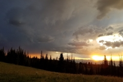 A sunset thunderstorm rolls into camp